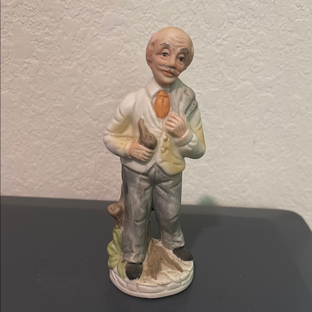 ✨ Charming Figurine with Orange Tie